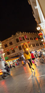 Illuminated city street at night