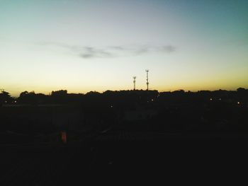 Silhouette landscape against sky during sunset