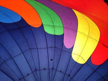 Low angle view of hot air balloon against blue sky
