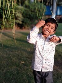 Full length of girl standing on field