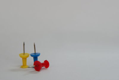 Close-up of multi colored toy over white background