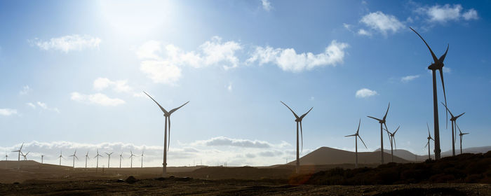 Landscape with wind turbines that produce electricity by rotating in the wind. wind farm eolic park