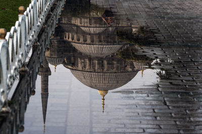 Reflection of sultan ahmed mosque on wet street