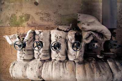 Covered machinery in old factory