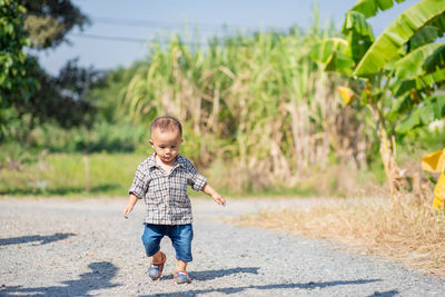 Full length of boy on road