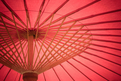 Low angle view of red umbrella