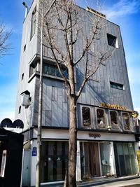 Low angle view of buildings against blue sky