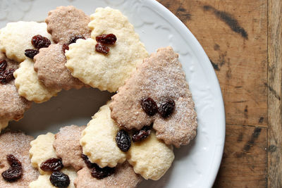 Directly above shot of heart shape cookies in plate on table