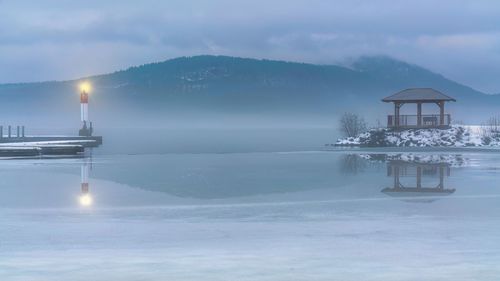 Viewing mount martin through the fog over ottawa river at deep river marina on a winter evening