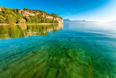 Scenic view of sea against blue sky