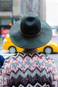 Close-up of person wearing hat