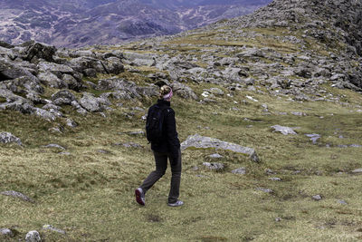 Full length of man standing on rock