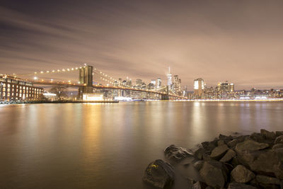 Illuminated city at waterfront