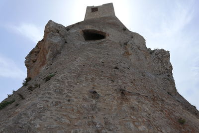 Low angle view of old building against sky