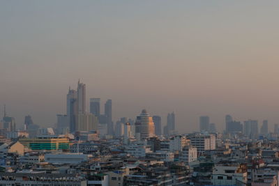 Cityscape against sky during sunset