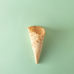 Ice cream cone on mint pastel background. minimal summer concept. flat lay.