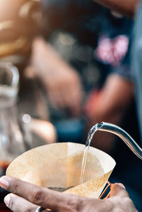 Close-up of hand holding drink