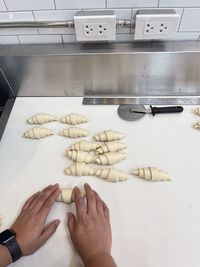 Midsection of person preparing food in kitchen