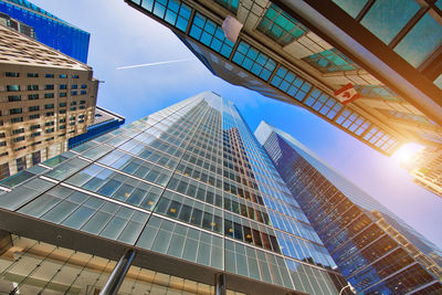 Low angle view of modern buildings against sky in city