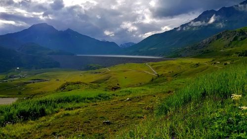 Scenic view of landscape and mountains against sky