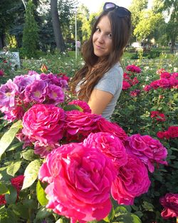 Portrait of smiling young woman standing outdoors