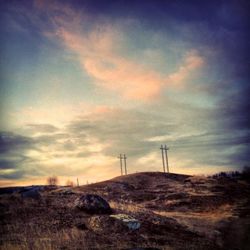 Scenic view of landscape against cloudy sky