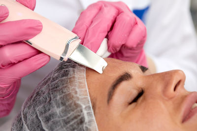 Cropped hand of doctor examining patient