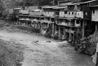 Stream flowing by houses