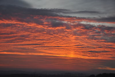 Low angle view of dramatic sky during sunset