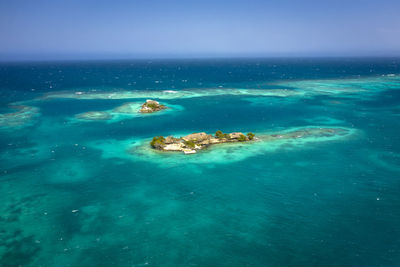 Scenic view of sea against blue sky