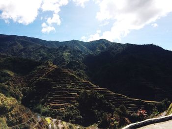 Scenic view of mountains against cloudy sky