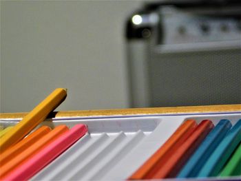 Close-up of colored pencils on table