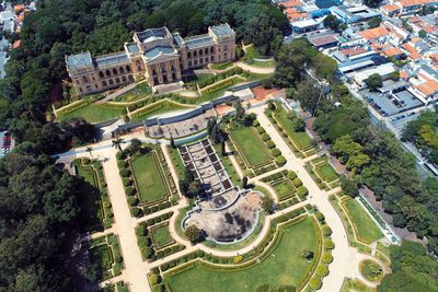 High angle view of buildings and trees in city