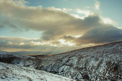 Scenic view of landscape against sky during winter