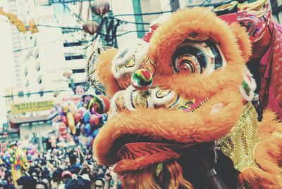 Close-up of dragon in carnival in city