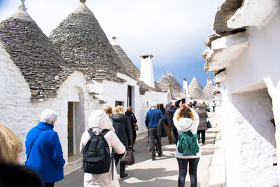 People walking in front of temple