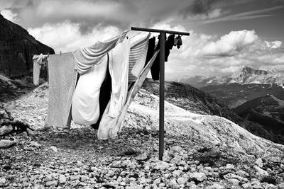 Clothes drying on clothesline against mountains