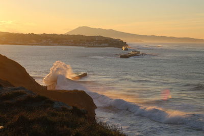 Scenic view of sea against sky during sunset