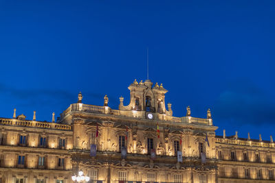 Low angle view of building against blue sky