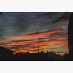 Low angle view of built structure at sunset