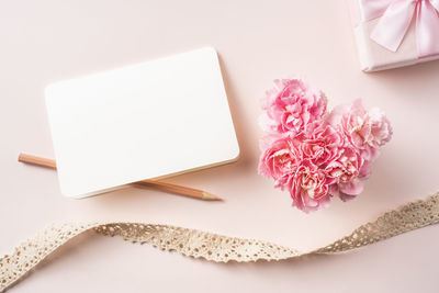 High angle view of pink flower on table