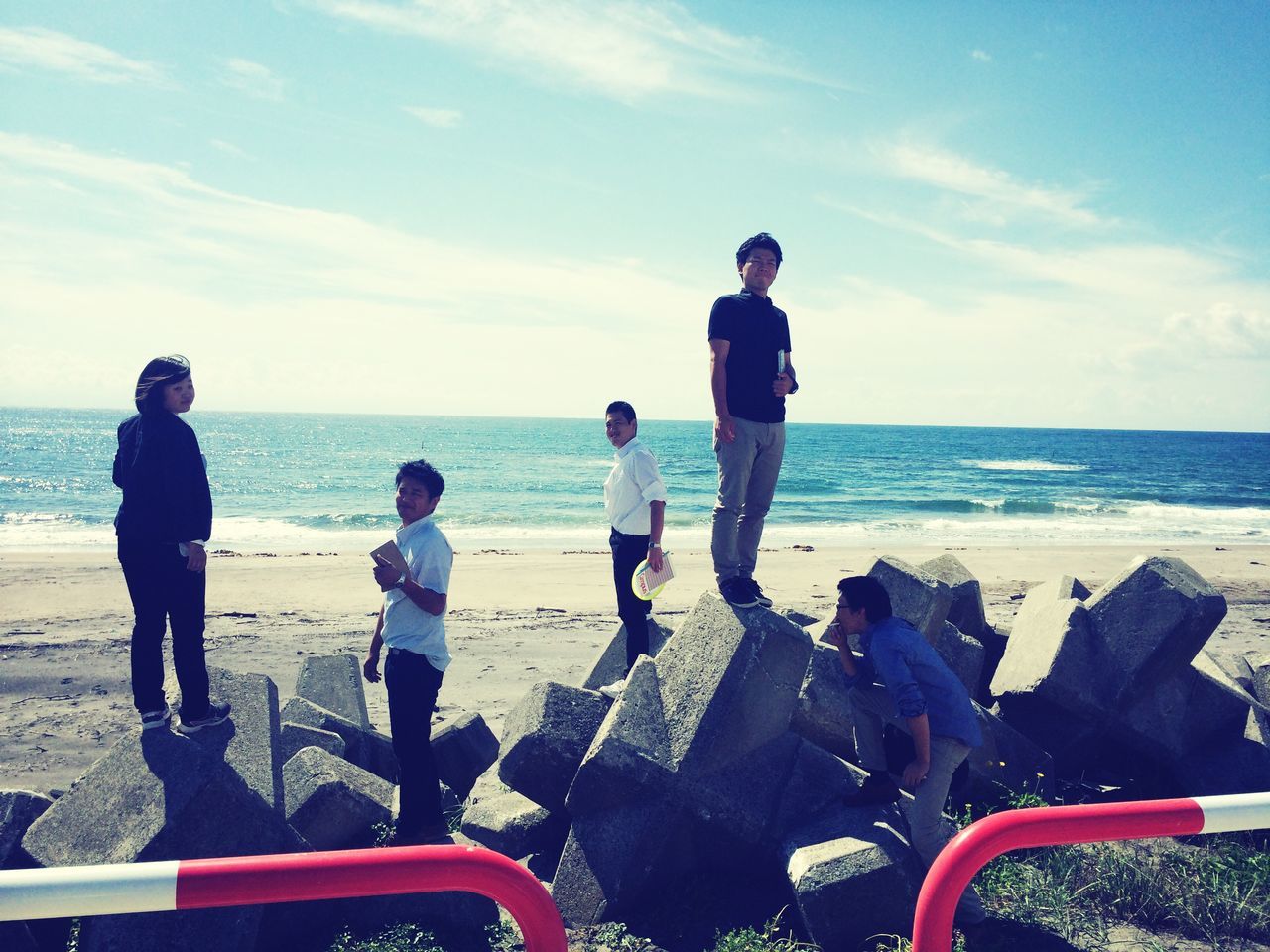 sea, sky, horizon over water, water, beach, lifestyles, leisure activity, full length, casual clothing, standing, transportation, rear view, shore, togetherness, cloud - sky, sitting, childhood, vacations