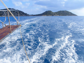 Sailboat sailing in sea against sky