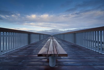 Pier over sea against sky