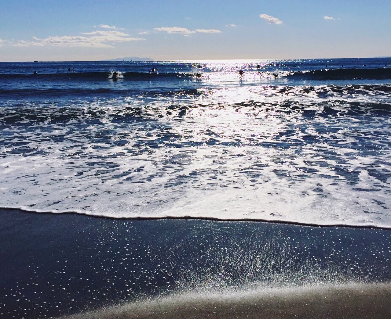 sea, water, horizon over water, beach, wave, shore, scenics, sky, nautical vessel, beauty in nature, tranquility, surf, tranquil scene, nature, sand, vacations, transportation, mode of transport, boat, idyllic