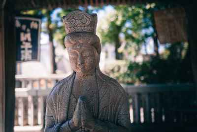 Close-up of statue against temple