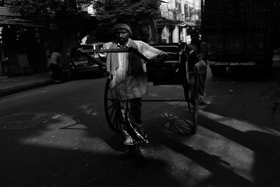 Man riding bicycle on road