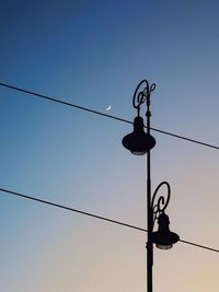 Low angle view of street light against clear sky