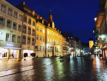 Illuminated buildings in city at night