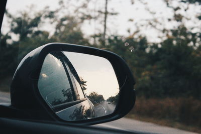 Cropped image of car on road